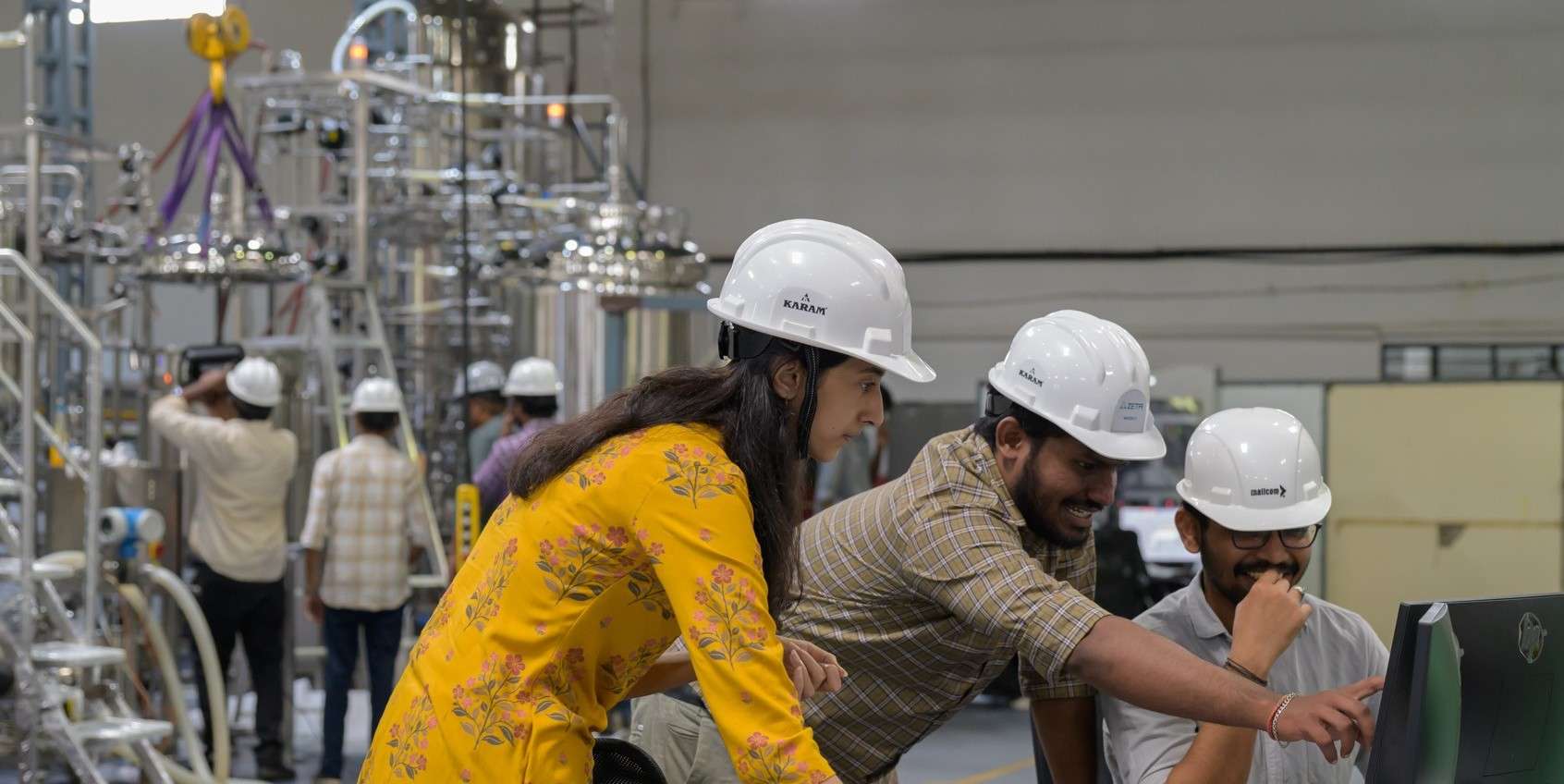 Zeta employees in the factory engaged in training