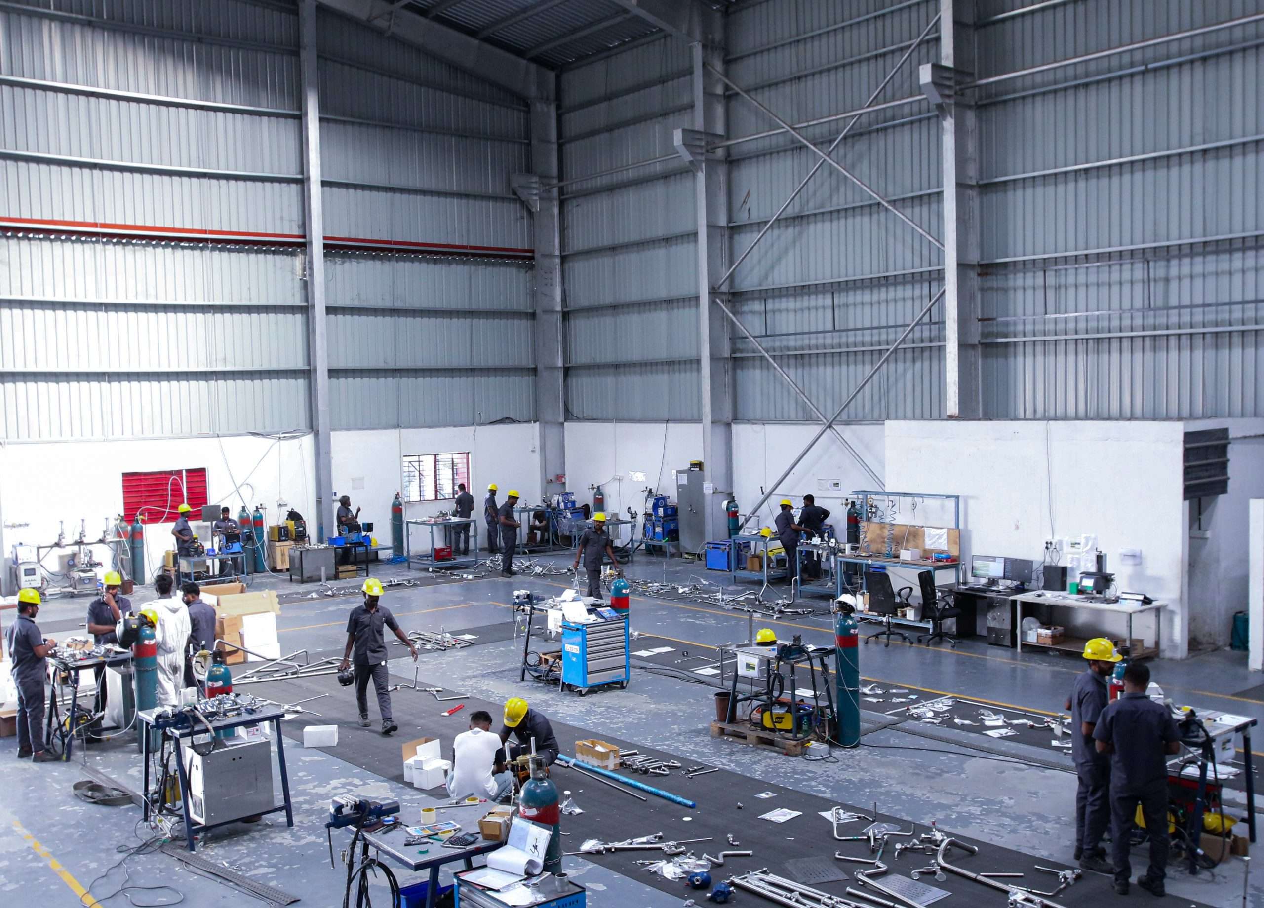 inside a modern biopharma facility with workers working